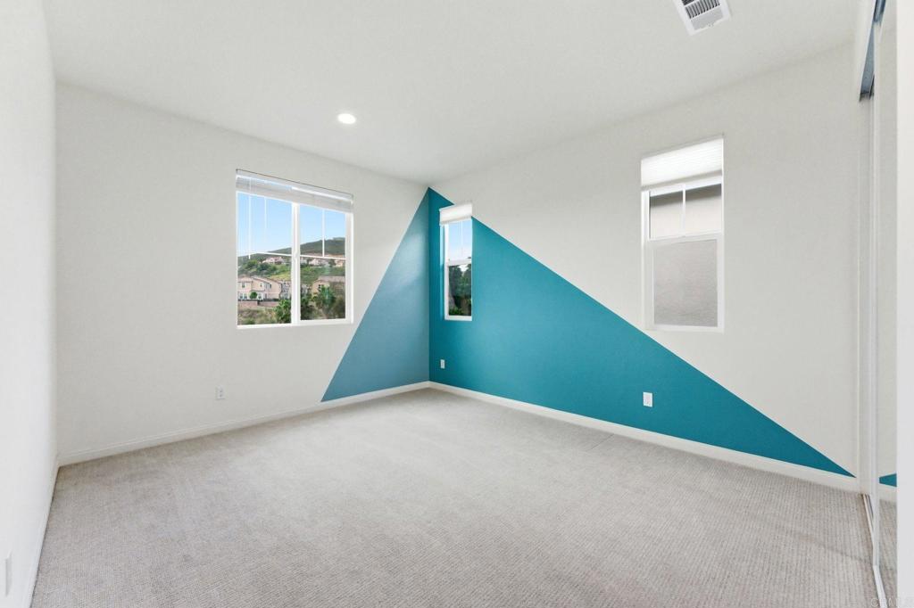 2711 Jujube Street Spring Valley, CA 91977 - Photo 14 of 31 an empty room with windows and closet