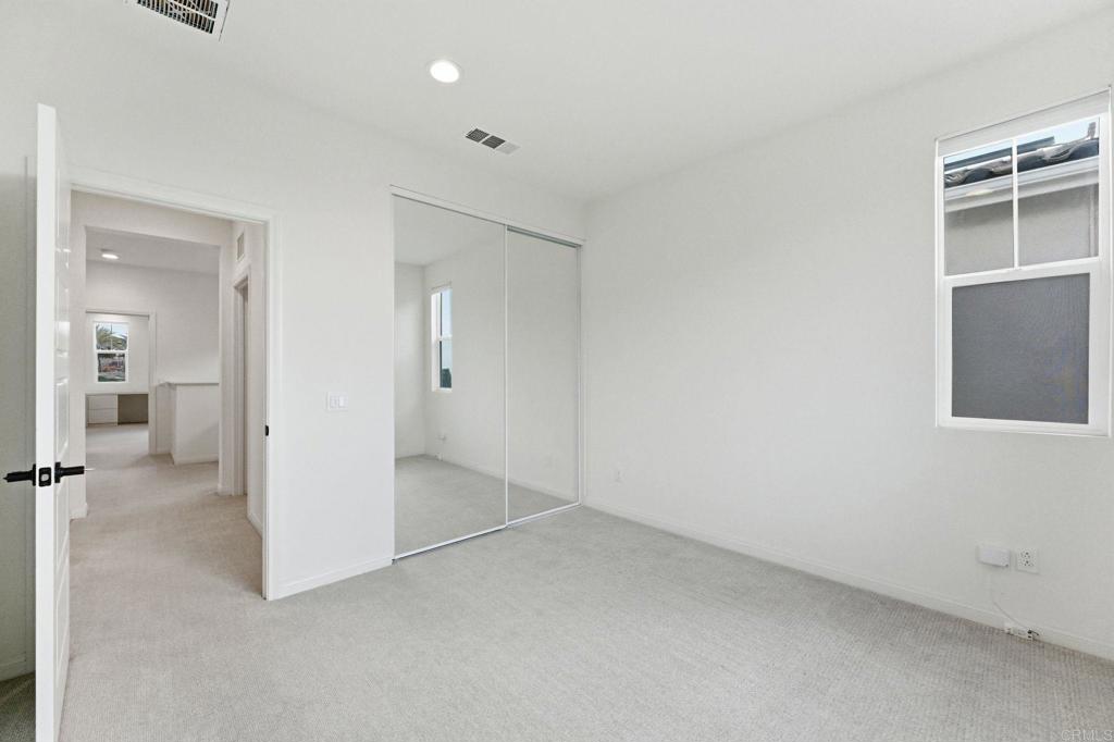 2711 Jujube Street Spring Valley, CA 91977 - Photo 16 of 31 an empty room with a cabinet and a window