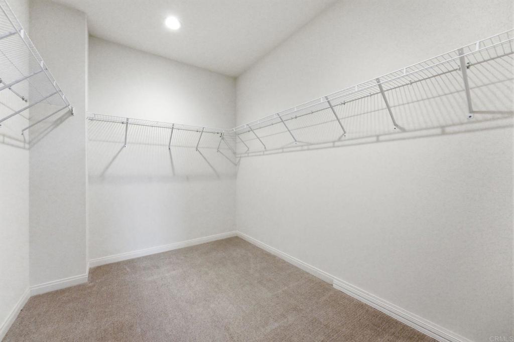 2711 Jujube Street Spring Valley, CA 91977 - Photo 20 of 31 a view of a room with racks on the wall