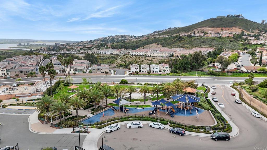 2711 Jujube Street Spring Valley, CA 91977 - Photo 27 of 31 an aerial view of a swimming pool with a yard and mountain view in back