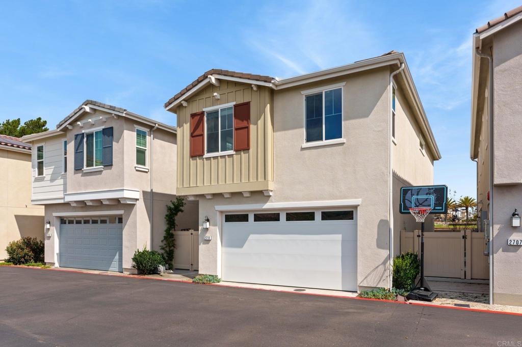 2711 Jujube Street Spring Valley, CA 91977 - Photo 4 of 31 a front view of a house with a garage