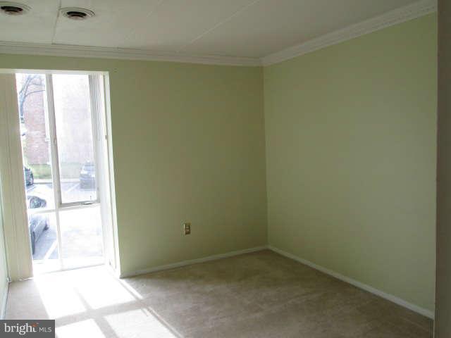 2624 Fort Farnsworth Road, Unit 209 Alexandria, VA 22303 - Photo 13 of 19 an empty room with windows