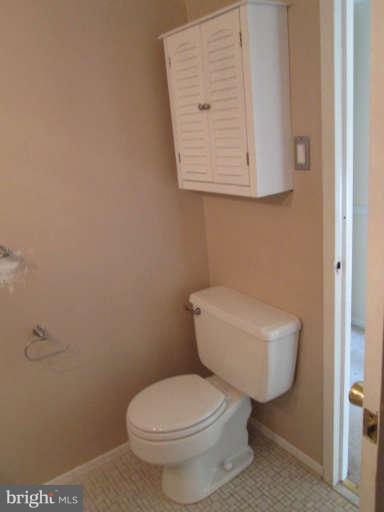 2624 Fort Farnsworth Road, Unit 209 Alexandria, VA 22303 - Photo 17 of 19 a white toilet sitting next to a bathroom sink