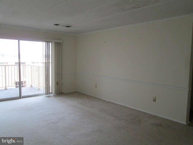 2624 Fort Farnsworth Road, Unit 209 Alexandria, VA 22303 - Photo 3 of 19 a view of an empty room with a window