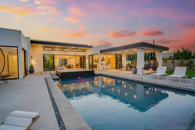 a view of a swimming pool with a lounge chair