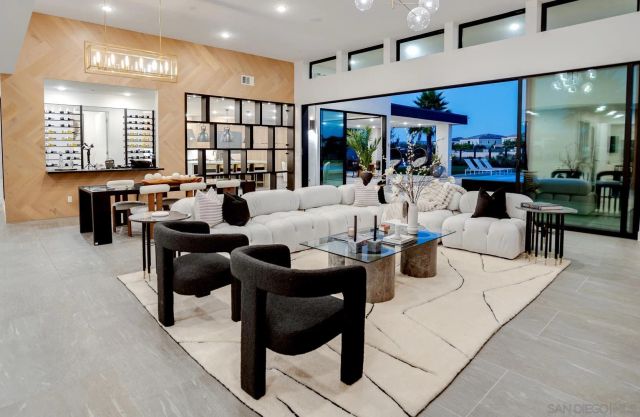 a very nice looking living room with furniture and a large window