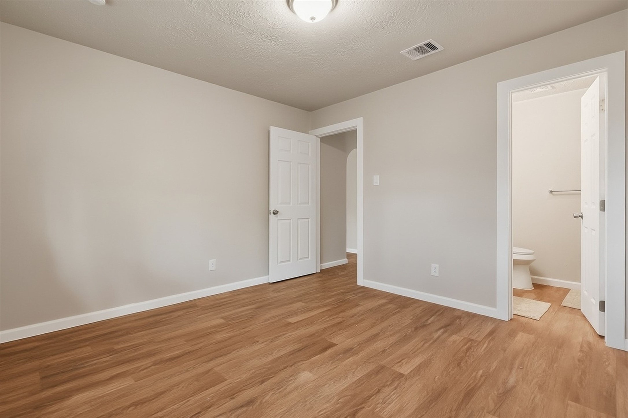 4767 Beechaven Street Houston, TX 77053 - Photo 9 of 26 a view of room with wooden floor