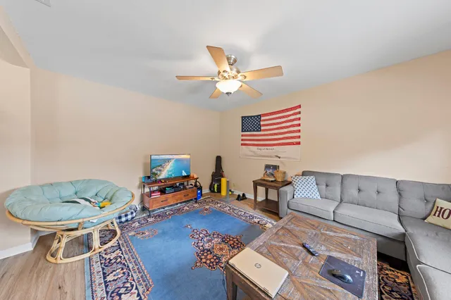 a kitchen with granite countertop cabinets stainless steel appliances and a window