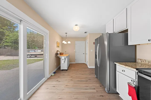 a view of a bathroom with a sink and a mirror