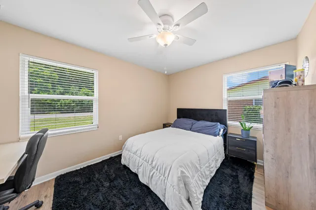 a bedroom with a workspace