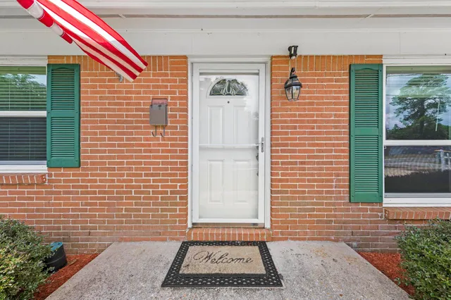 a view of a brick house with front door