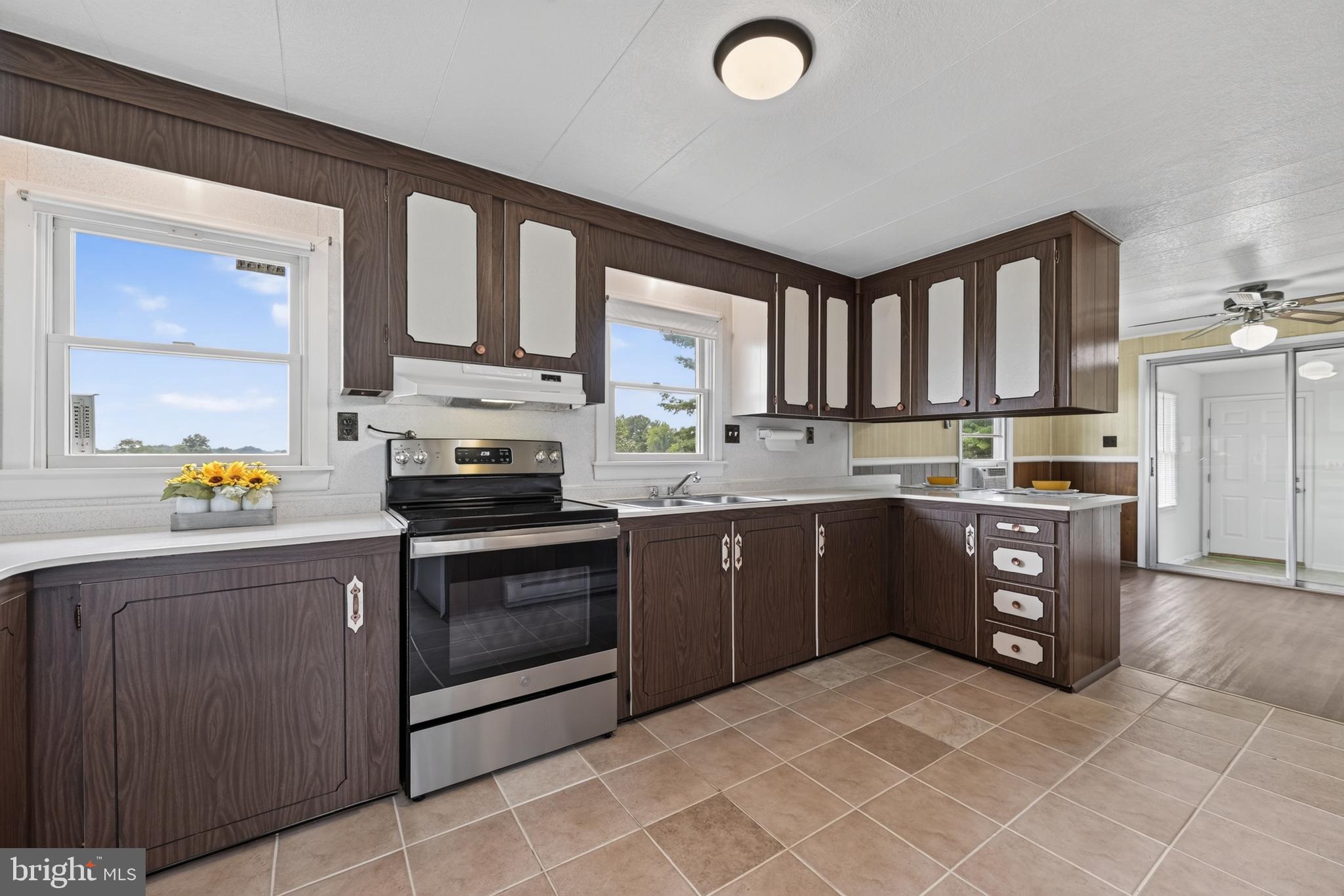 13835 Howard Road Dayton, MD 21036 - Photo 20 of 43 Ceramic tile floor and double windows in kitchen