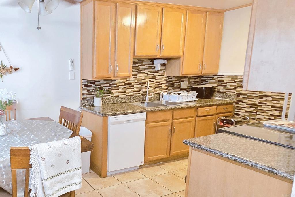 505 East Madison Avenue, Unit 70 El Cajon, CA 92020 - Photo 2 of 13 a kitchen with stainless steel appliances granite countertop a sink stove and cabinets