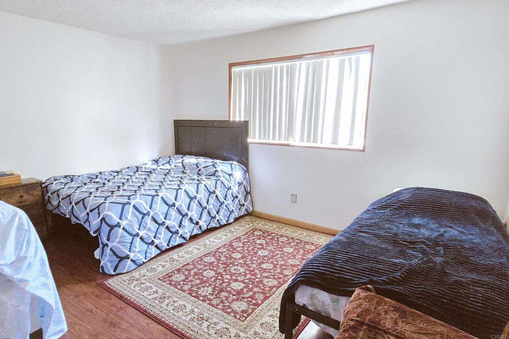 505 East Madison Avenue, Unit 70 El Cajon, CA 92020 - Photo 5 of 13 a bedroom with a bed and a window