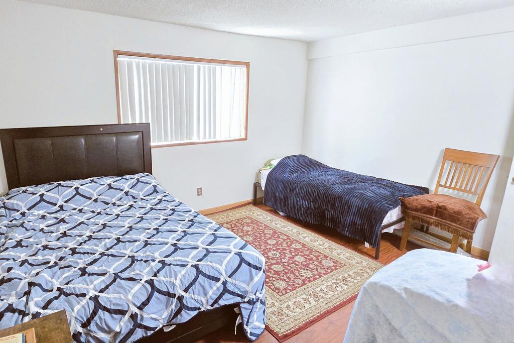505 East Madison Avenue, Unit 70 El Cajon, CA 92020 - Photo 8 of 13 a bedroom with a bed and a couch