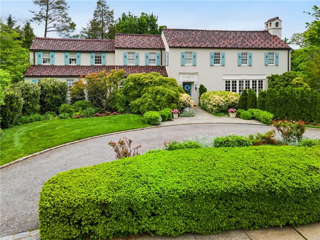 Mediterranean / spanish-style home featuring a front lawn