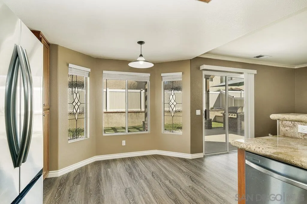 11212 Callio Way Lakeside, CA 92040 - Photo 14 of 50 wooden floor in an empty room with a window