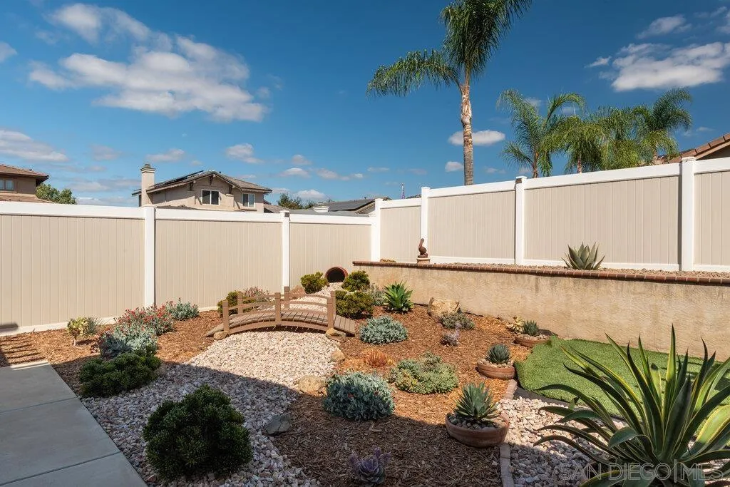 11212 Callio Way Lakeside, CA 92040 - Photo 34 of 50 a view of a lake with a floor to ceiling window and potted plants