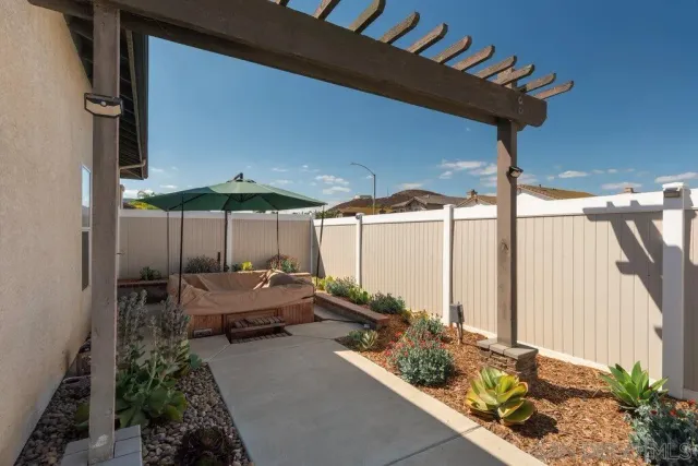 a view of backyard with patio