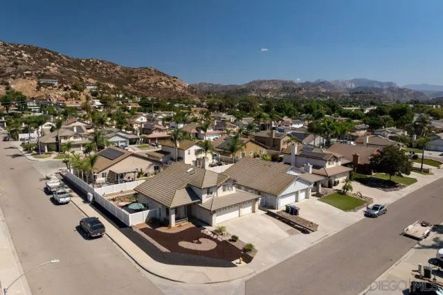 an aerial view of residential houses with outdoor space