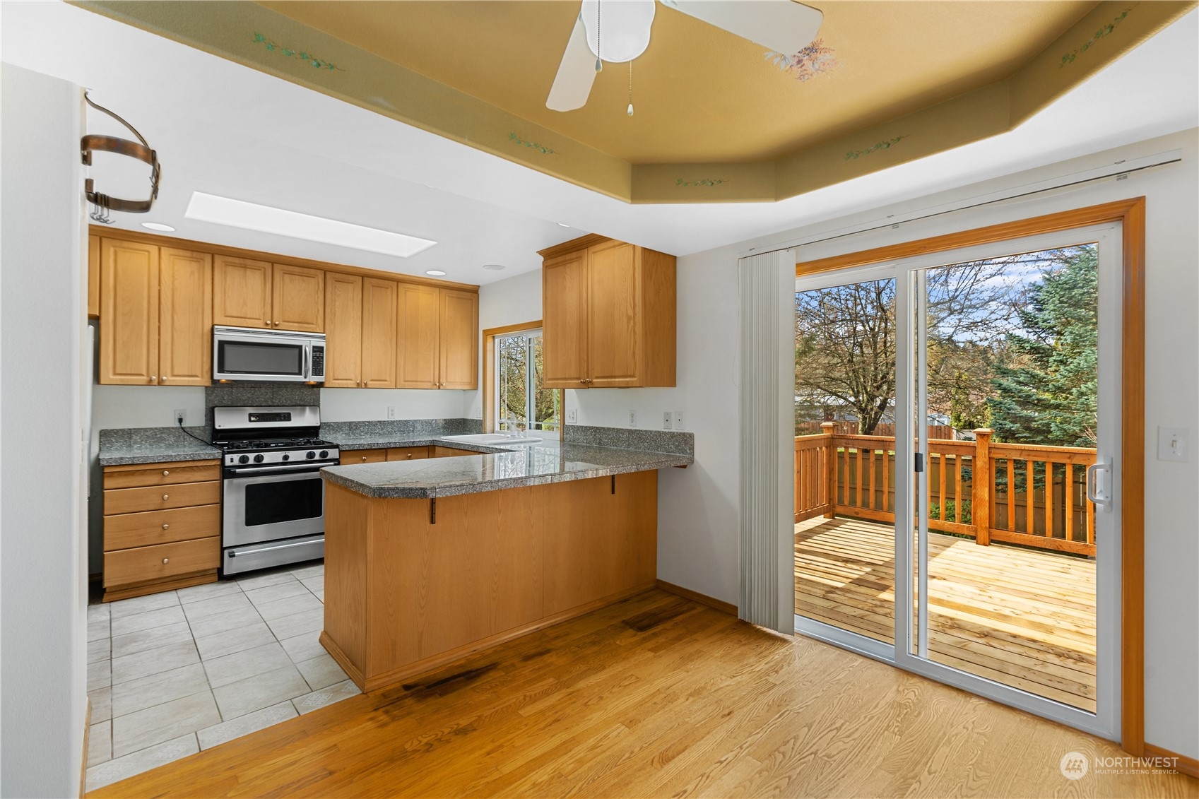 24216 13th Place West Bothell, WA 98021 - Photo 11 of 37 a kitchen with stainless steel appliances granite countertop a stove and a refrigerator