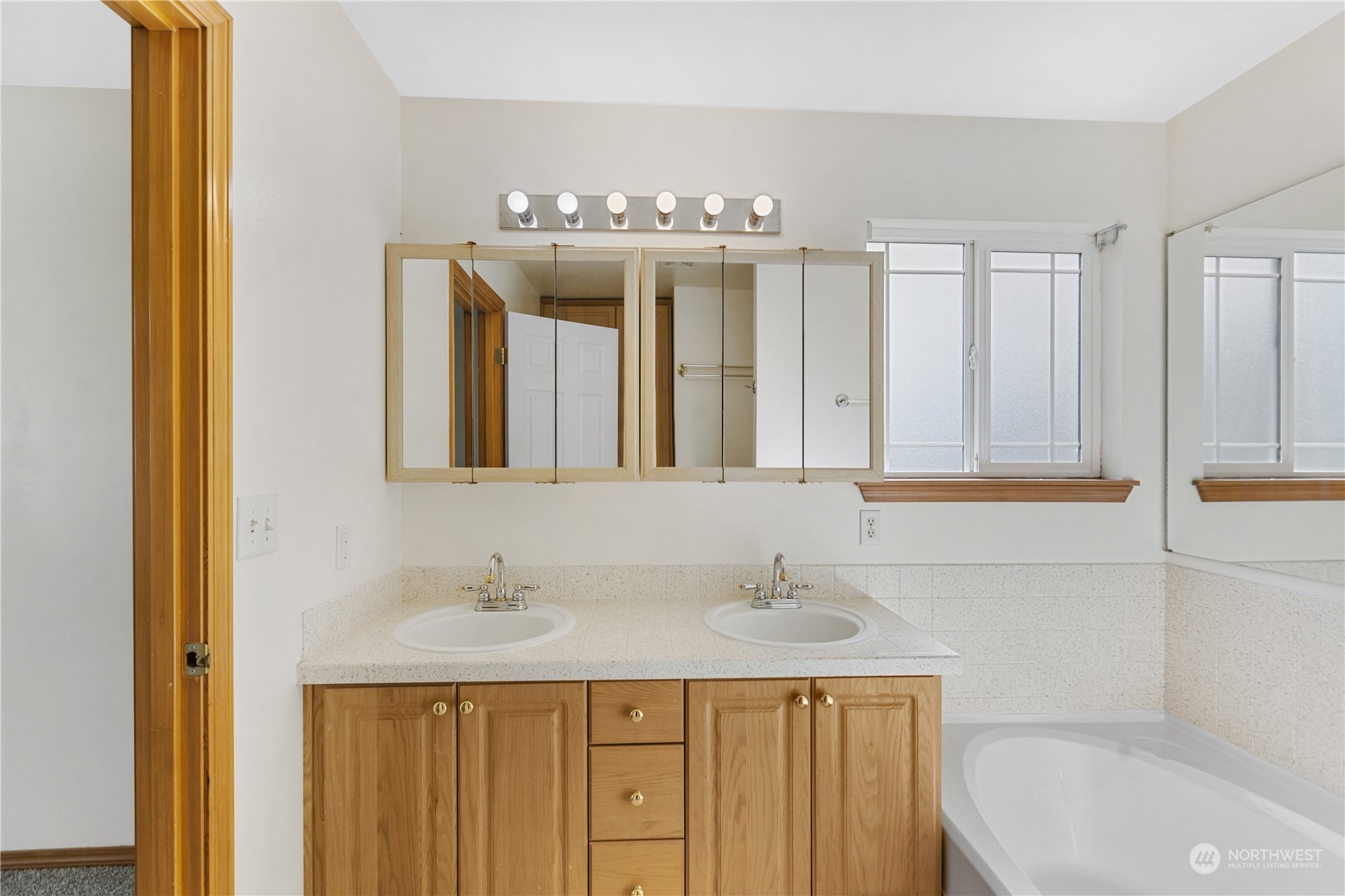 24216 13th Place West Bothell, WA 98021 - Photo 23 of 37 a bathroom with a sink and a mirror