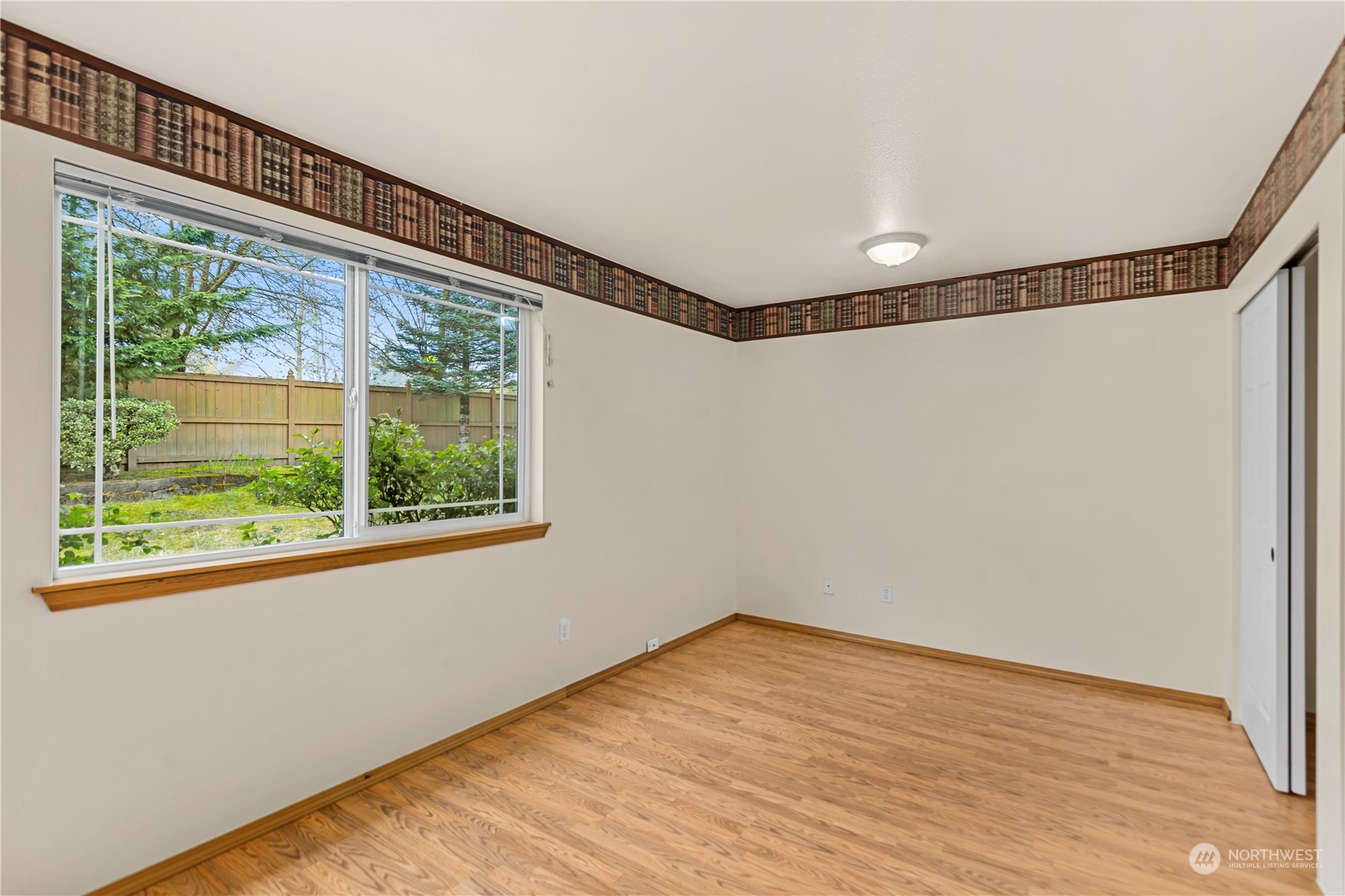 24216 13th Place West Bothell, WA 98021 - Photo 31 of 37 a view of a big room with wooden floor and windows