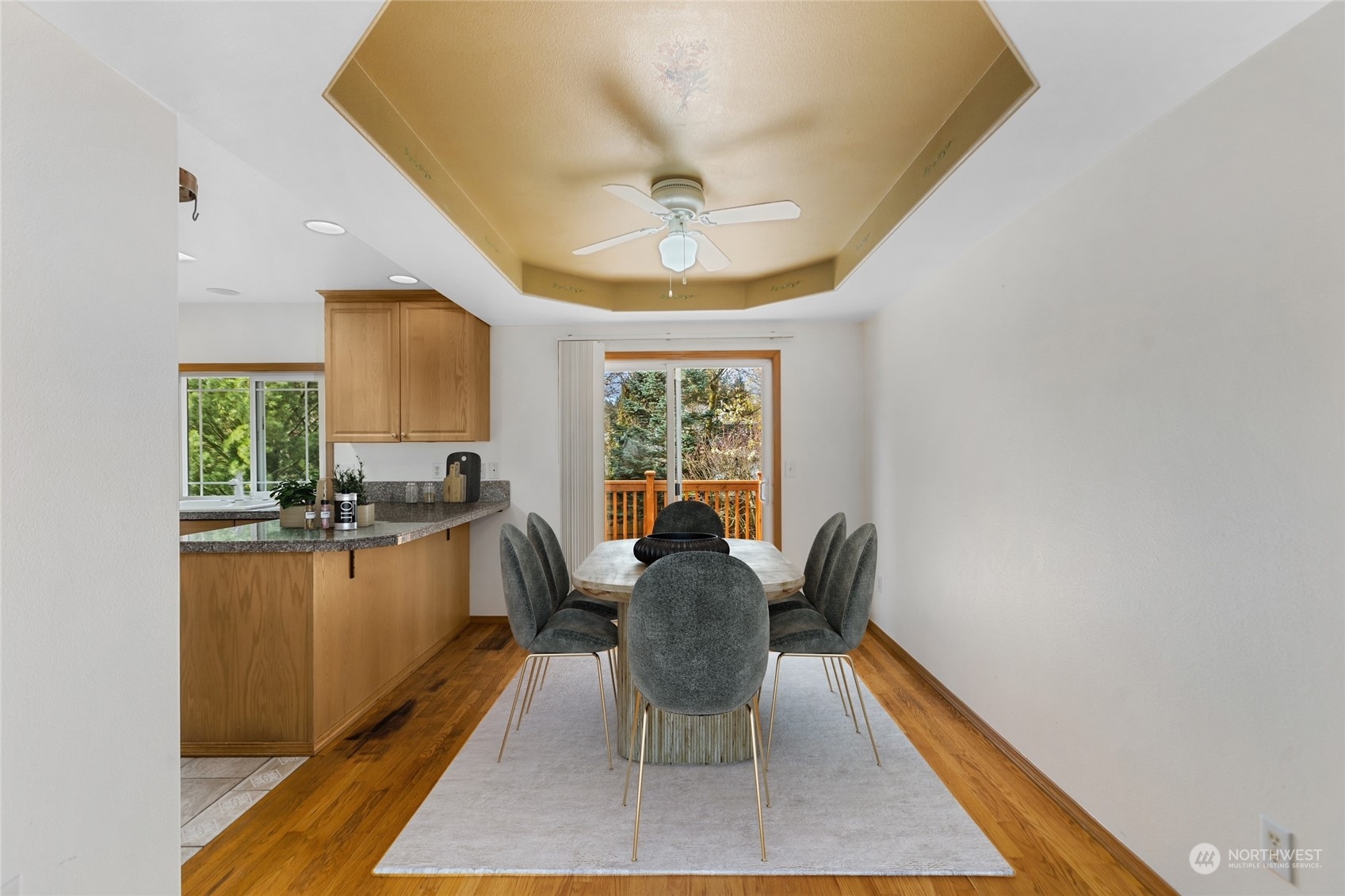 24216 13th Place West Bothell, WA 98021 - Photo 10 of 37 a dining room with furniture a chandelier and wooden floor