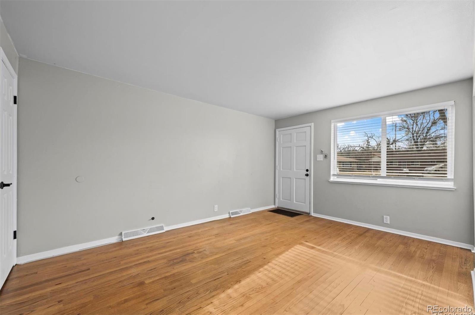 8795 West 46th Avenue Wheat Ridge, CO 80033 - Photo 9 of 12 a view of an empty room with a window