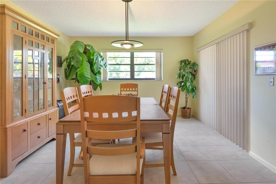 23090 Southwest 56th Avenue Boca Raton, FL 33433 - Photo 21 of 49 a view of a dining room with furniture window and outside view