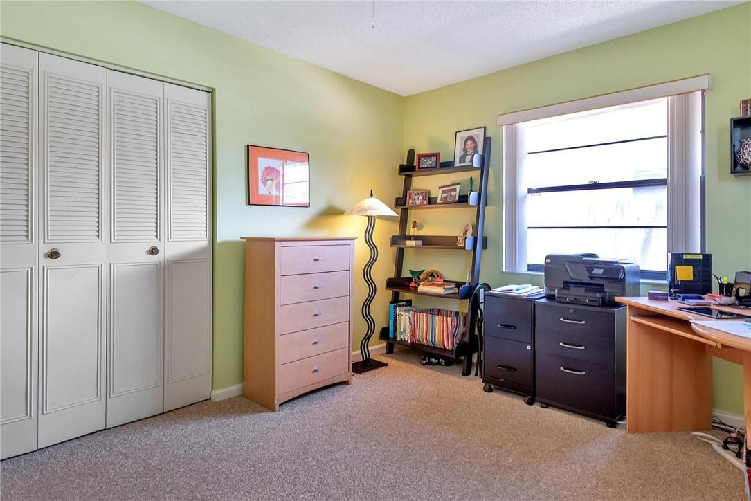 23090 Southwest 56th Avenue Boca Raton, FL 33433 - Photo 25 of 49 a view of a workspace with furniture and a window