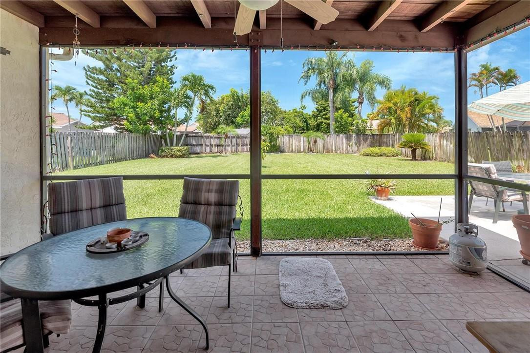 23090 Southwest 56th Avenue Boca Raton, FL 33433 - Photo 39 of 49 a view of a patio with a table chairs and a table