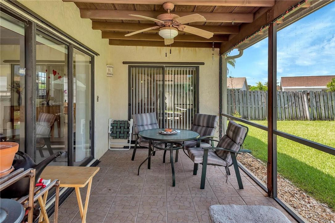 23090 Southwest 56th Avenue Boca Raton, FL 33433 - Photo 42 of 49 a balcony with furniture and a potted plant