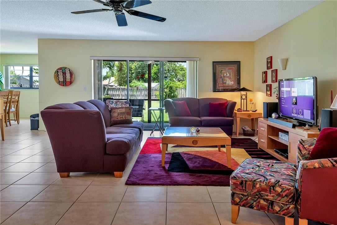 23090 Southwest 56th Avenue Boca Raton, FL 33433 - Photo 5 of 49 a bedroom with furniture and a window