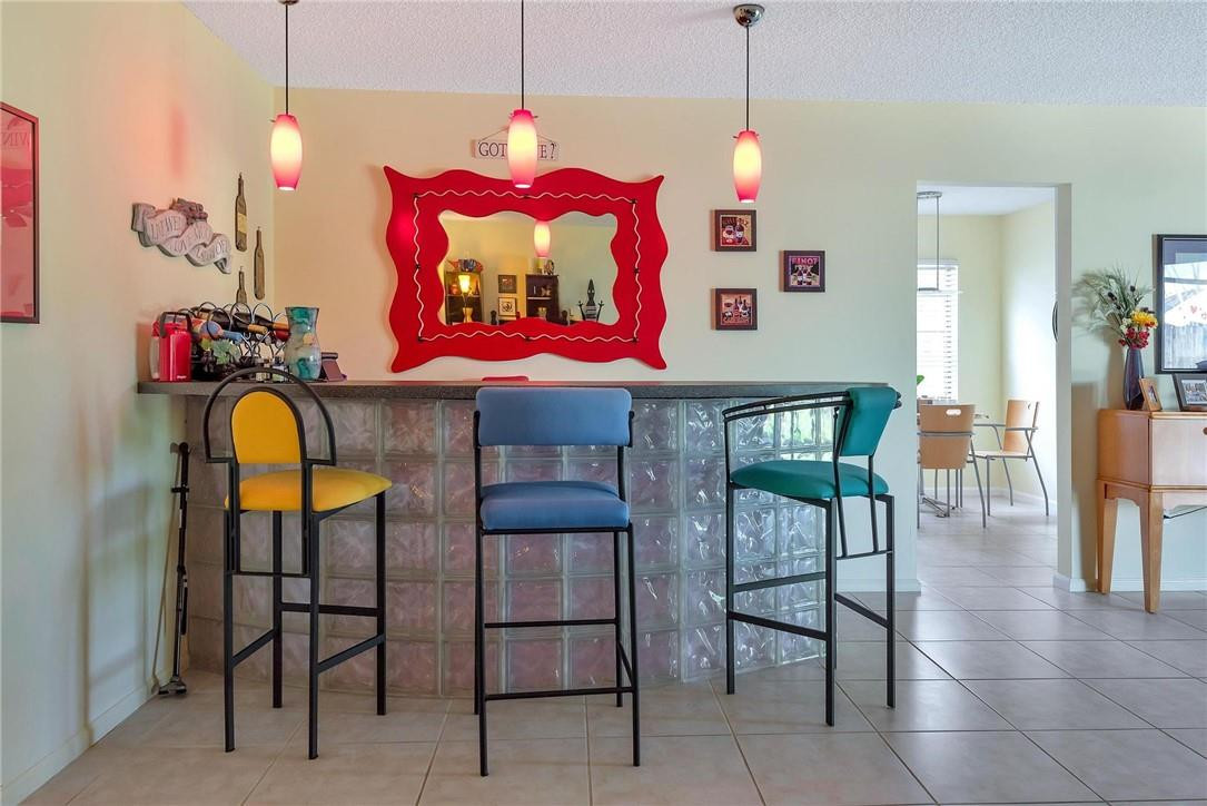 23090 Southwest 56th Avenue Boca Raton, FL 33433 - Photo 6 of 49 a view of a dining room with furniture and chandelier