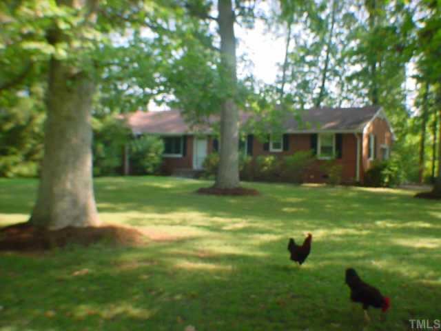 6118 Mebane Oaks Road Mebane, NC 27302 - Photo 1 of 7 Front of home with large front yard with Mature trees.