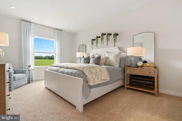 a bedroom with bed and a window