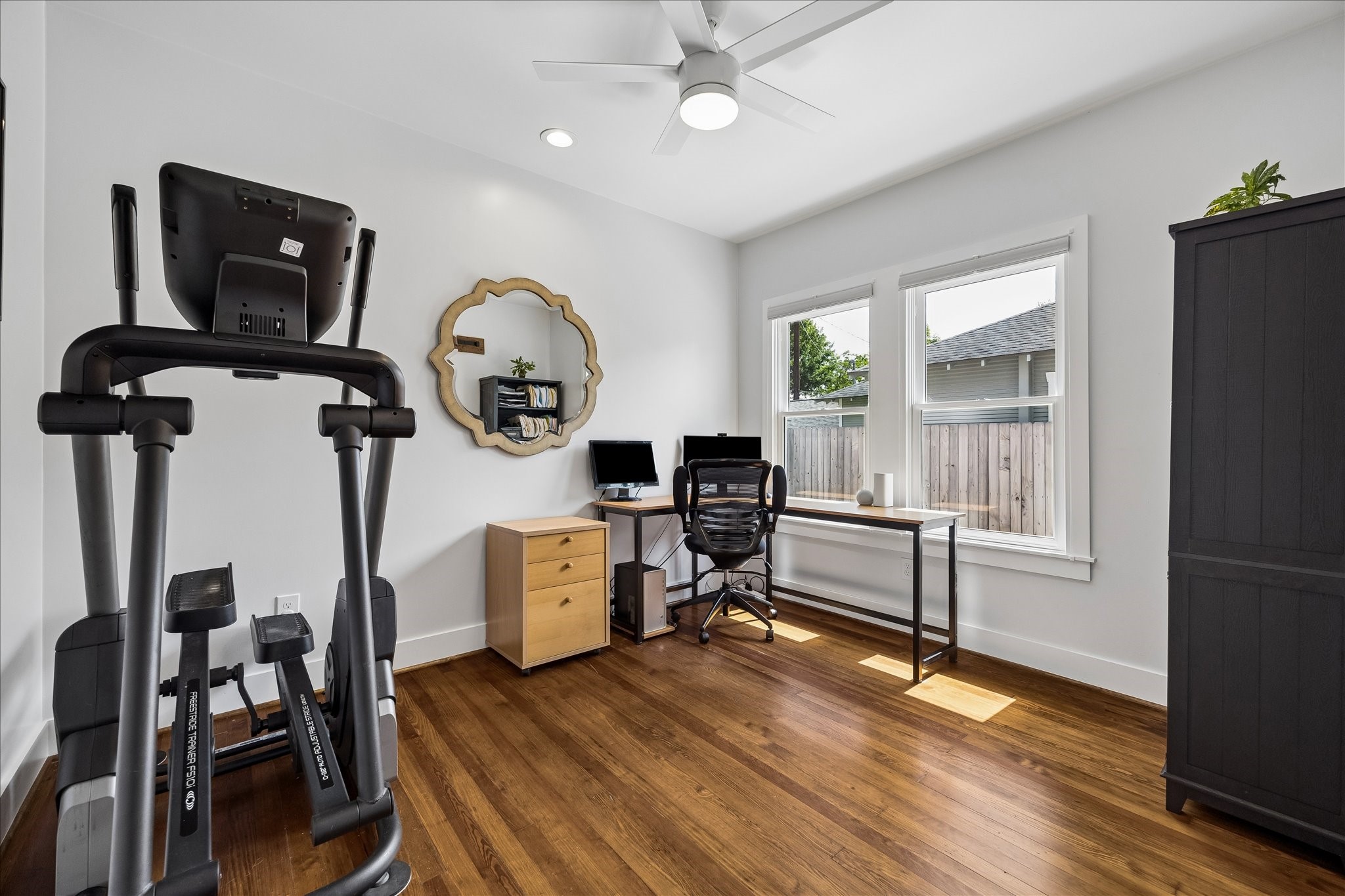 1019 East 14th Street Houston, TX 77009 - Photo 21 of 34 a living room with furniture a flat screen tv and wooden floor