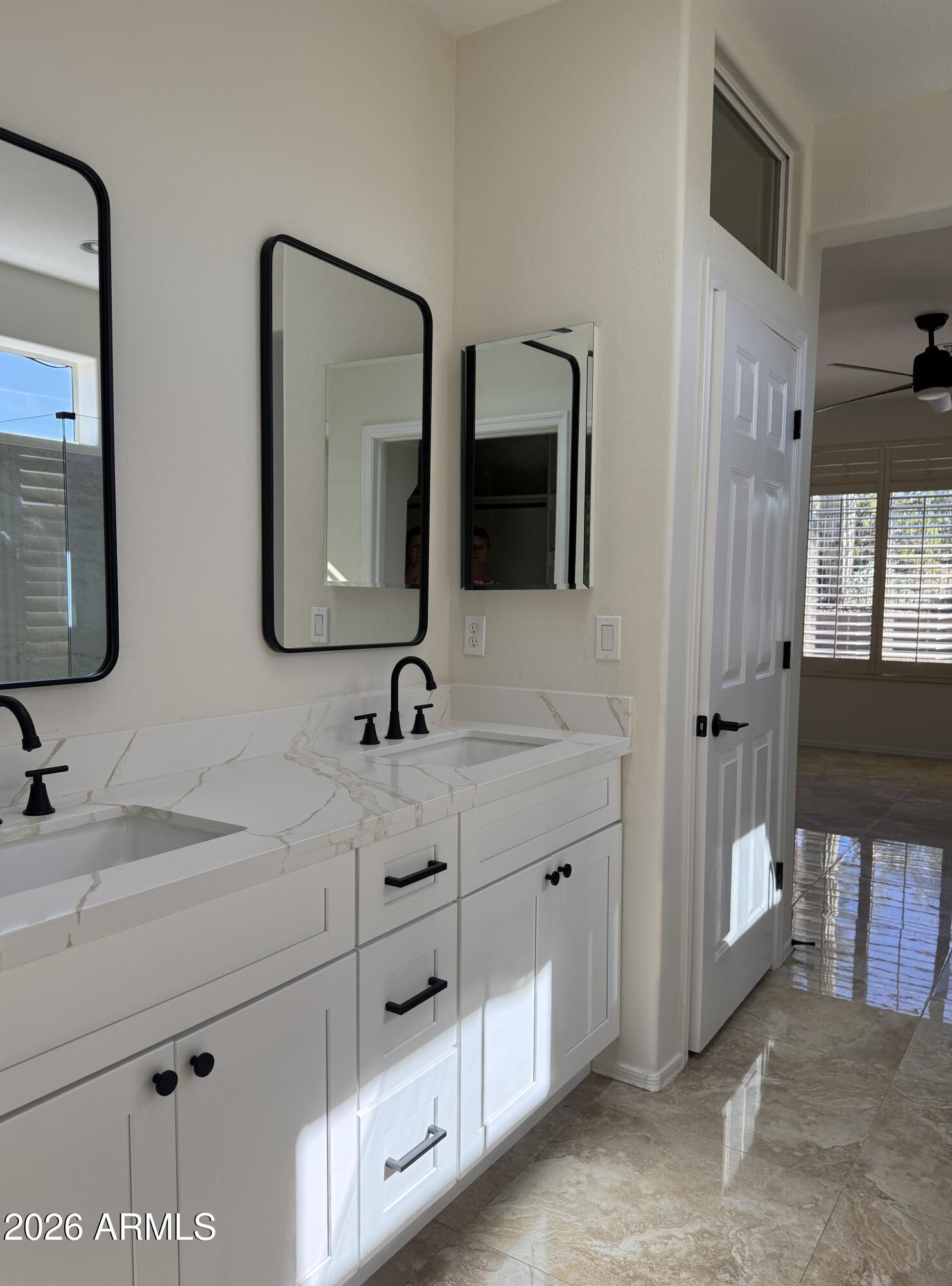 41915 North Crooked Stick Road Anthem, AZ 85086 - Photo 11 of 29 a bathroom with a double vanity sink and mirror