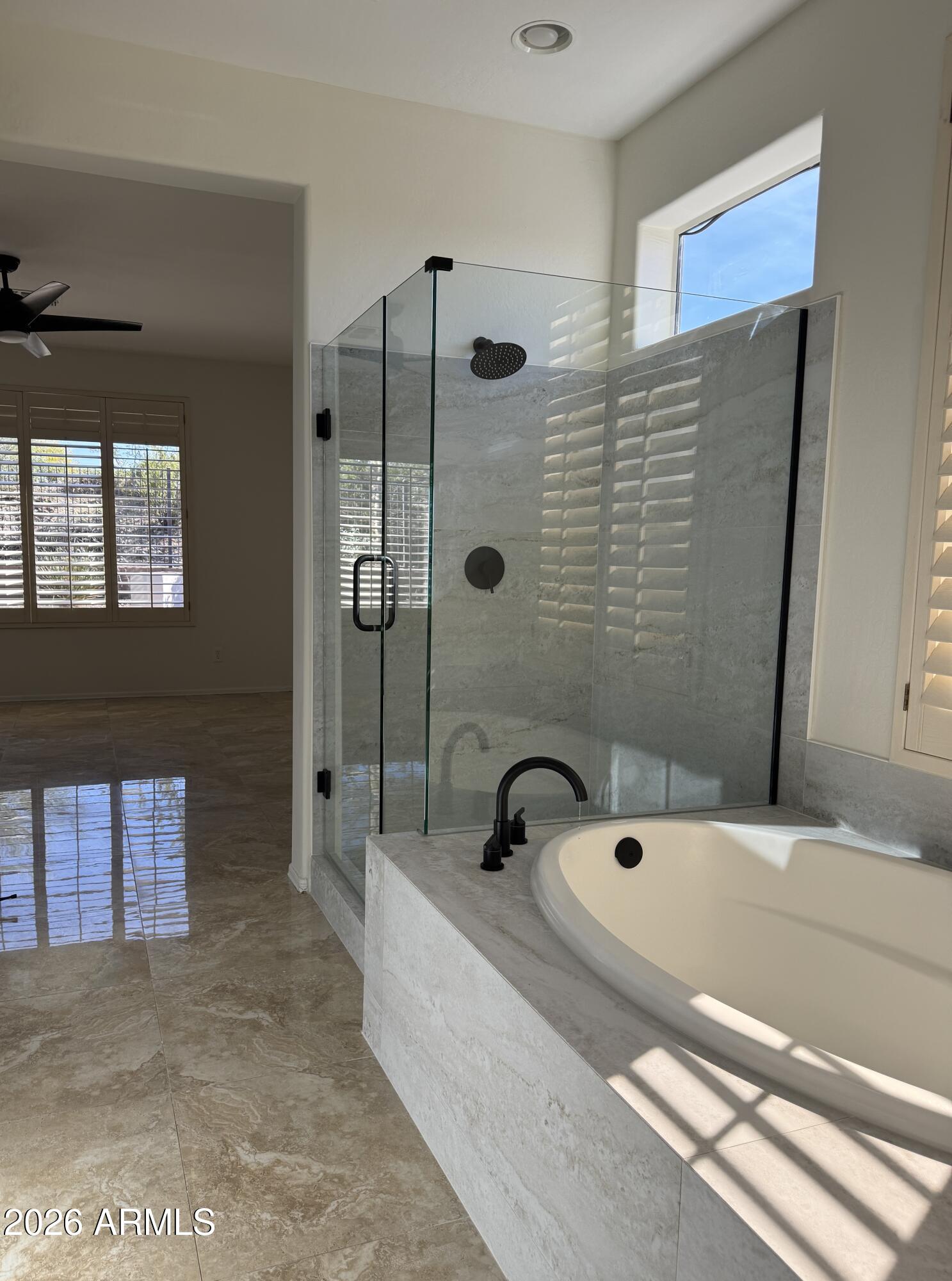 41915 North Crooked Stick Road Anthem, AZ 85086 - Photo 12 of 29 a bathroom with a tub and a shower