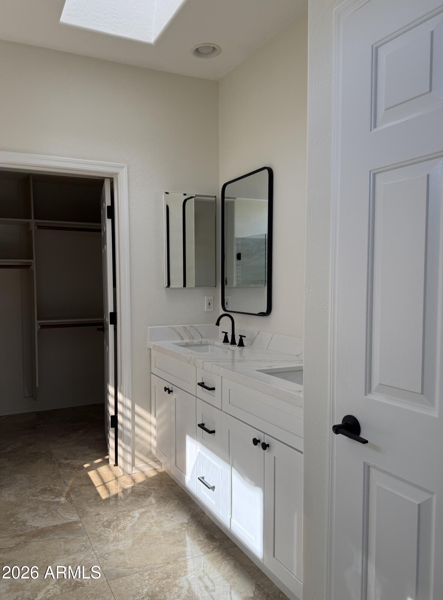 41915 North Crooked Stick Road Anthem, AZ 85086 - Photo 13 of 29 a bathroom with a double vanity sink and mirror