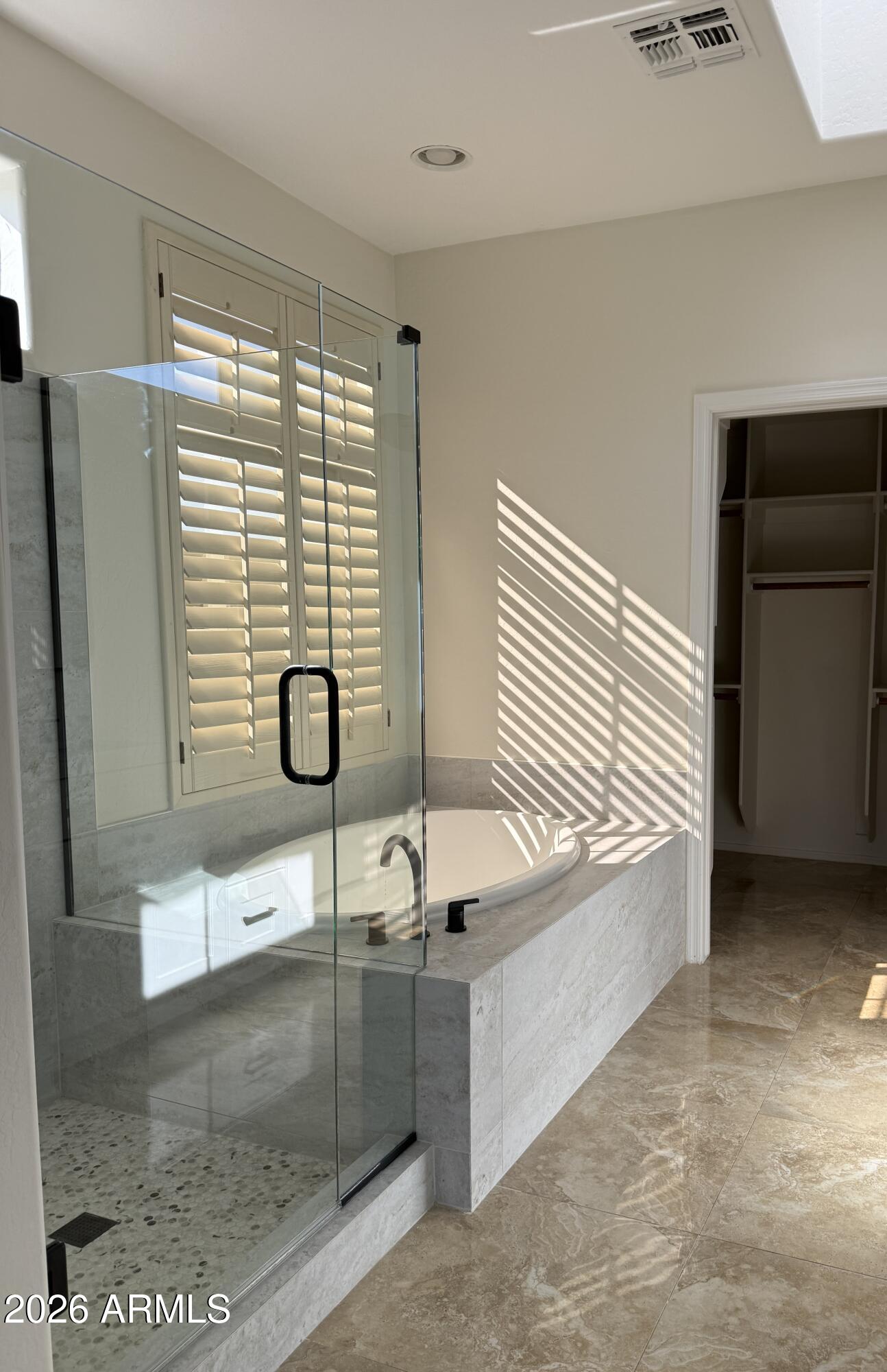 41915 North Crooked Stick Road Anthem, AZ 85086 - Photo 14 of 29 a bathroom with a bathtub and shower