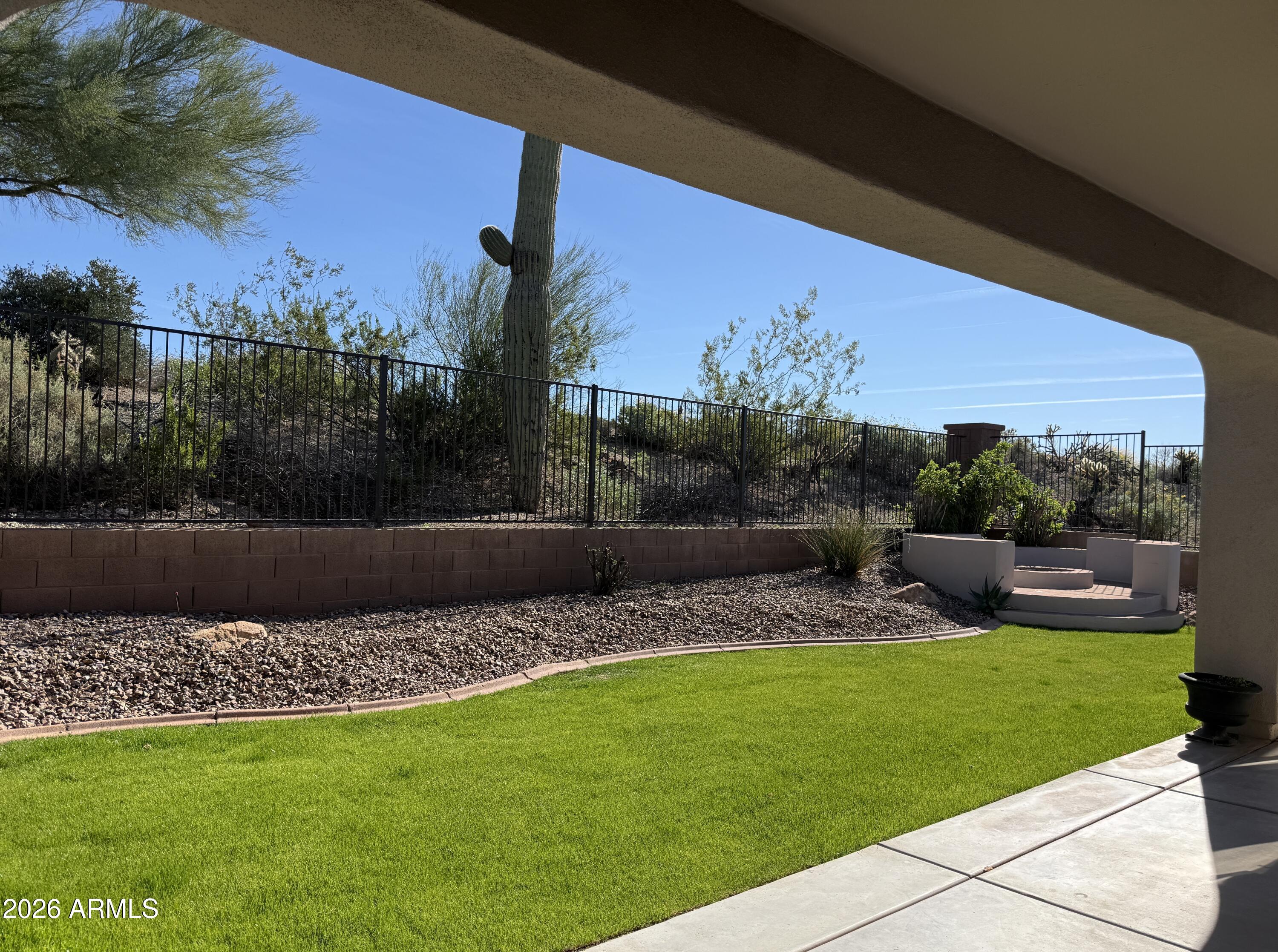 41915 North Crooked Stick Road Anthem, AZ 85086 - Photo 15 of 29 a view of a garden and living room