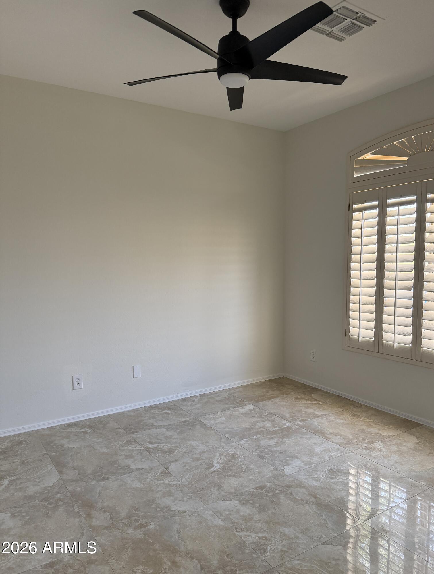 41915 North Crooked Stick Road Anthem, AZ 85086 - Photo 20 of 29 an empty room with a empty space and a ceiling fan
