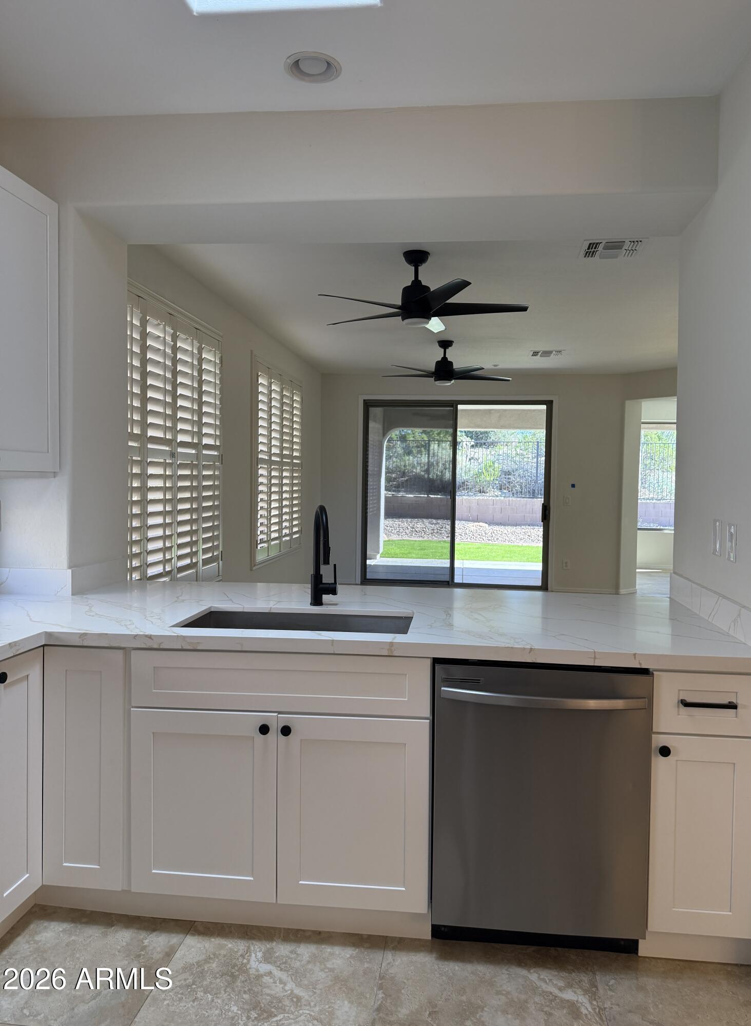 41915 North Crooked Stick Road Anthem, AZ 85086 - Photo 2 of 29 a kitchen with a sink and cabinets