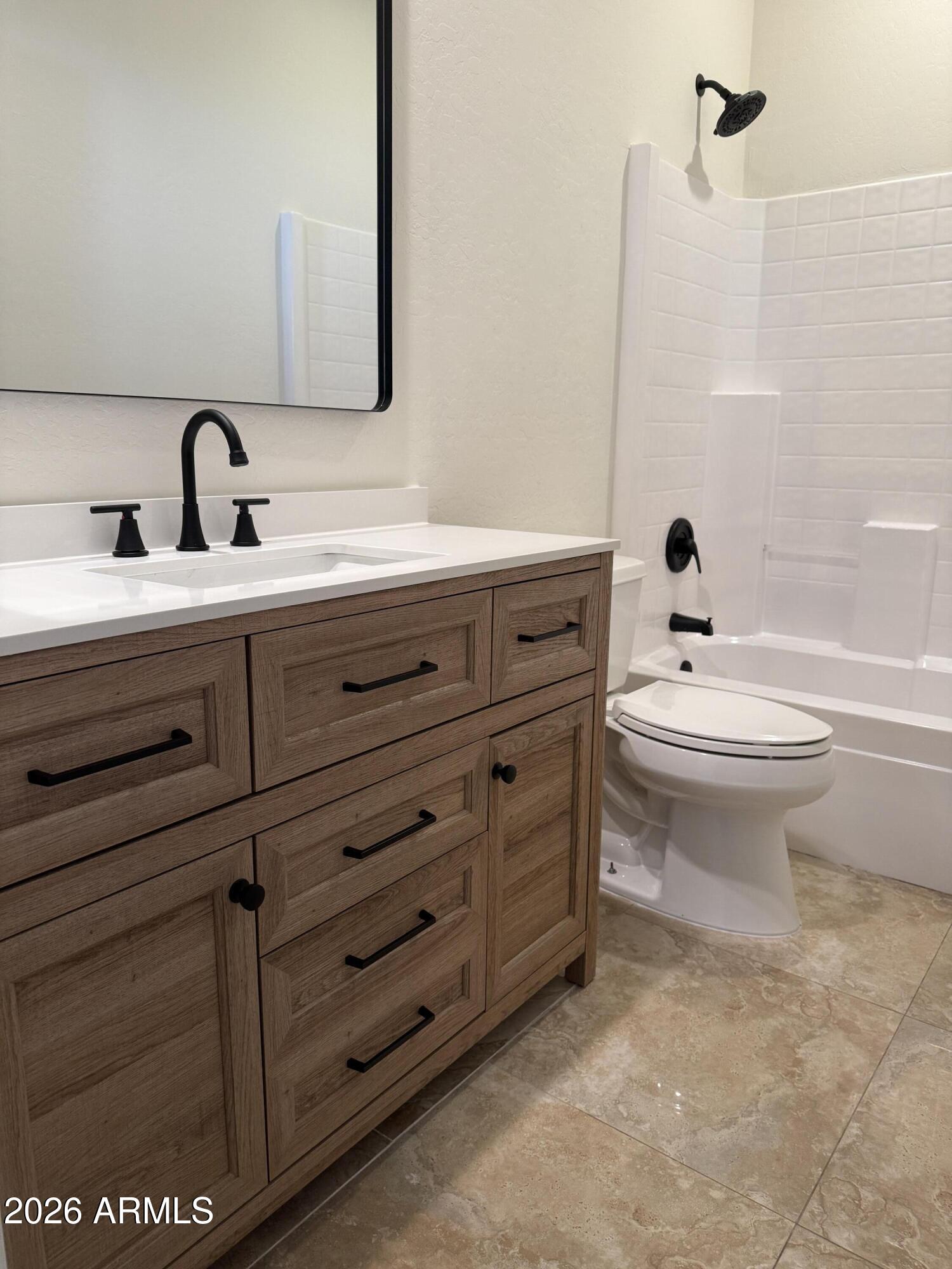 41915 North Crooked Stick Road Anthem, AZ 85086 - Photo 21 of 29 a bathroom with a sink toilet and mirror