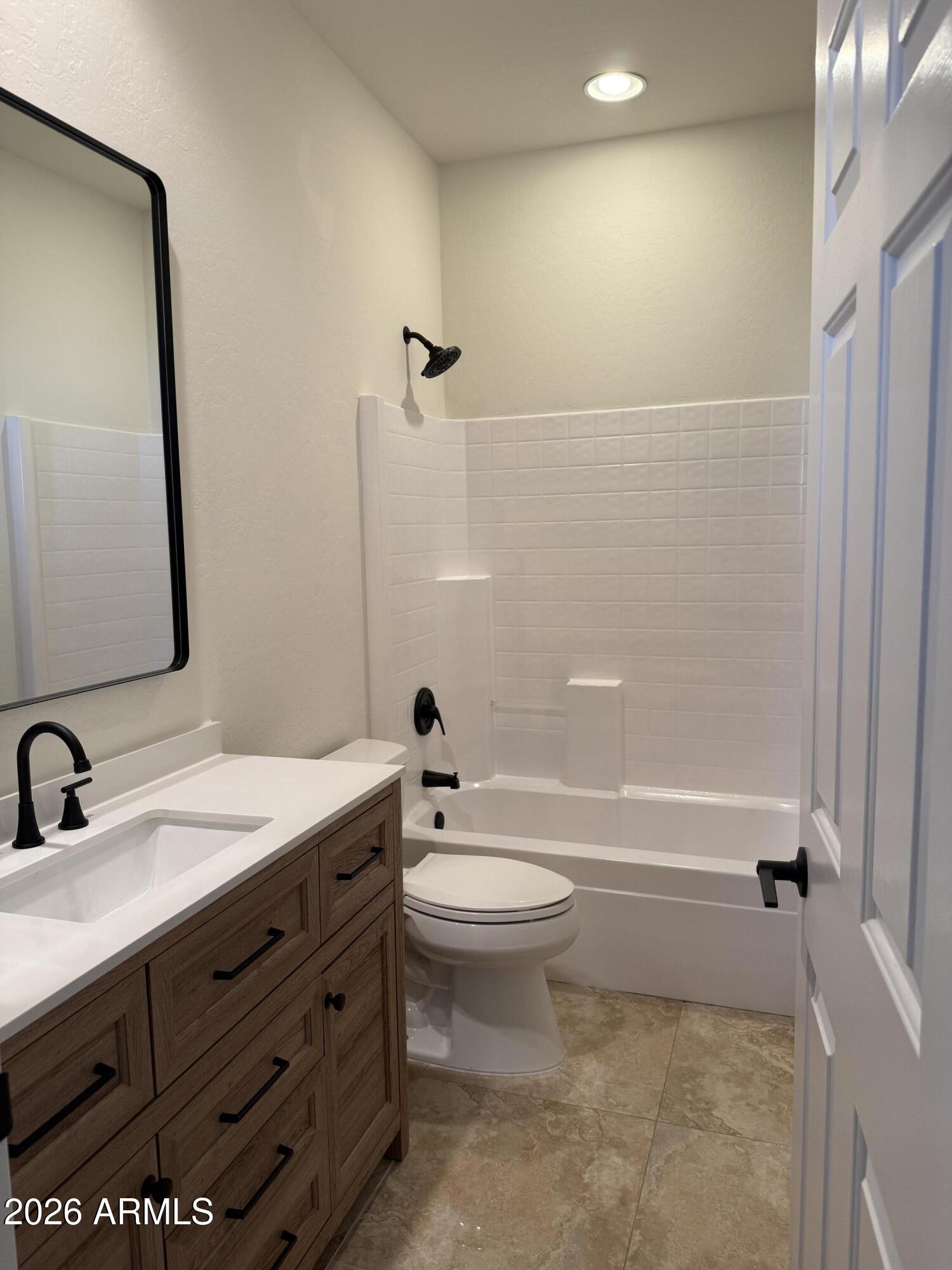 41915 North Crooked Stick Road Anthem, AZ 85086 - Photo 22 of 29 a bathroom with a sink a toilet and shower