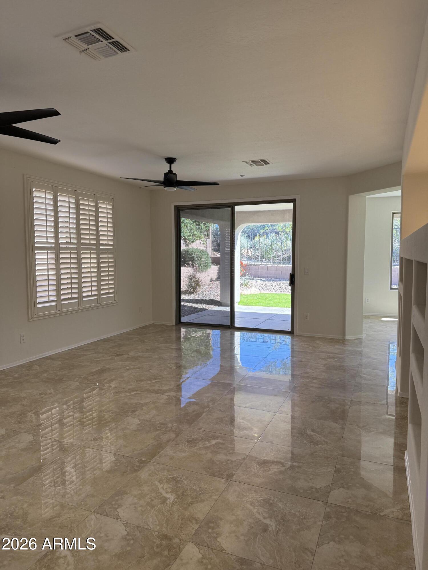 41915 North Crooked Stick Road Anthem, AZ 85086 - Photo 8 of 29 wooden floor in an empty room with a window