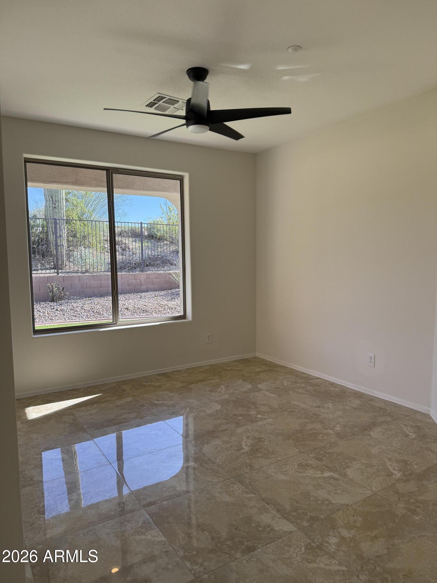 41915 North Crooked Stick Road Anthem, AZ 85086 - Photo 10 of 29 a view of an empty room with a window