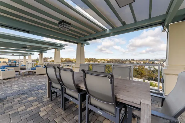 a view of a terrace with couches and lounge chair